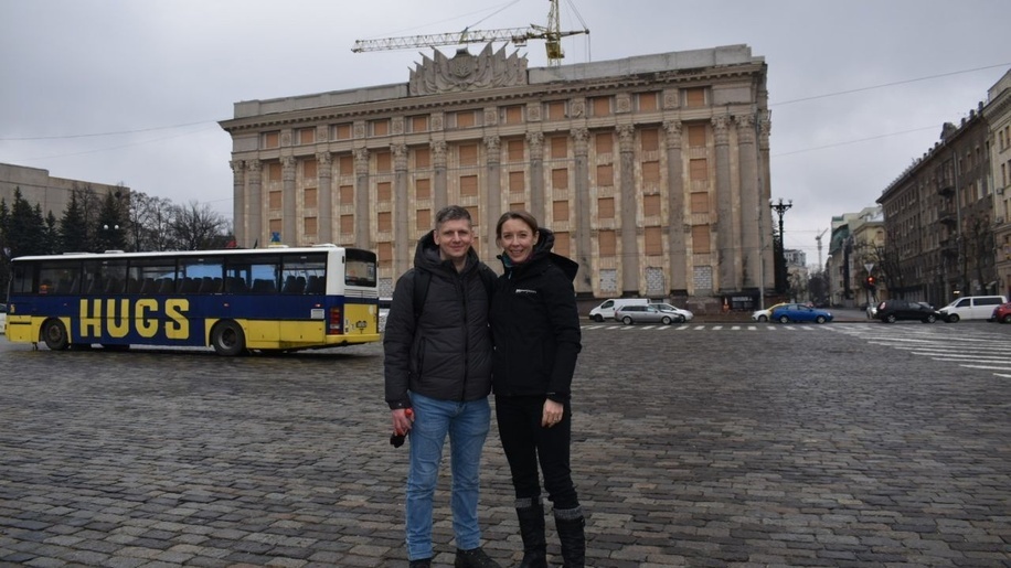 Slava Mavrychev and Liz Corbin in front of Kharkiv City Hall on Freedom Square